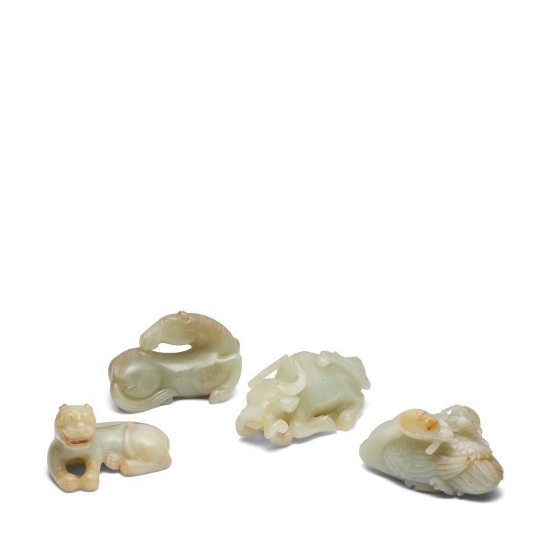 二十世紀 青白玉雕臥獸四件 | FOUR PALE CELADON JADE CARVINGS OF RECUMBENT ANIMALS