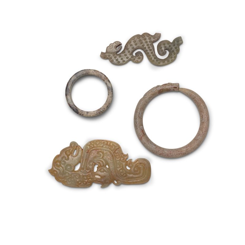 二十世紀仿戰國 龍形玉珮兩件 龍形玉手環一件 石刻小環一件 | FOUR ARCHAIC-STYLE JADE AND HARDSTONE ORNAMENTS