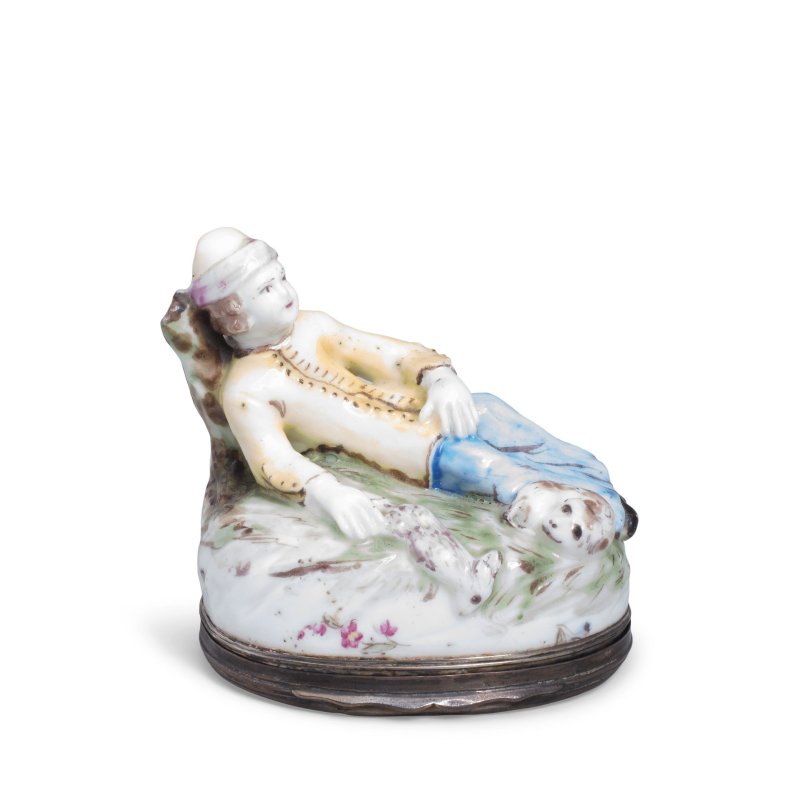 A Mennecy silver-mounted snuff box and cover in the shape of a hunter and his dog, circa 1750