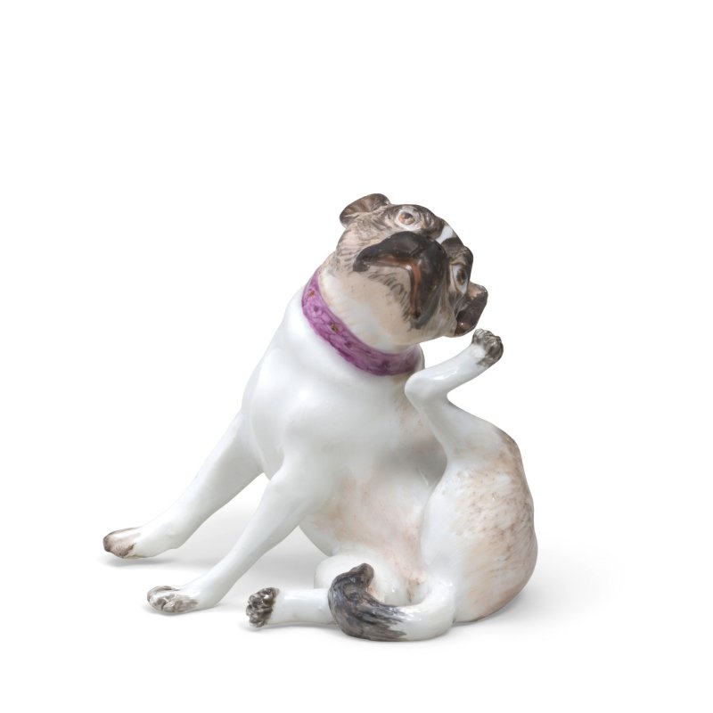 A Meissen miniature figure of a seated pug dog, circa 1745