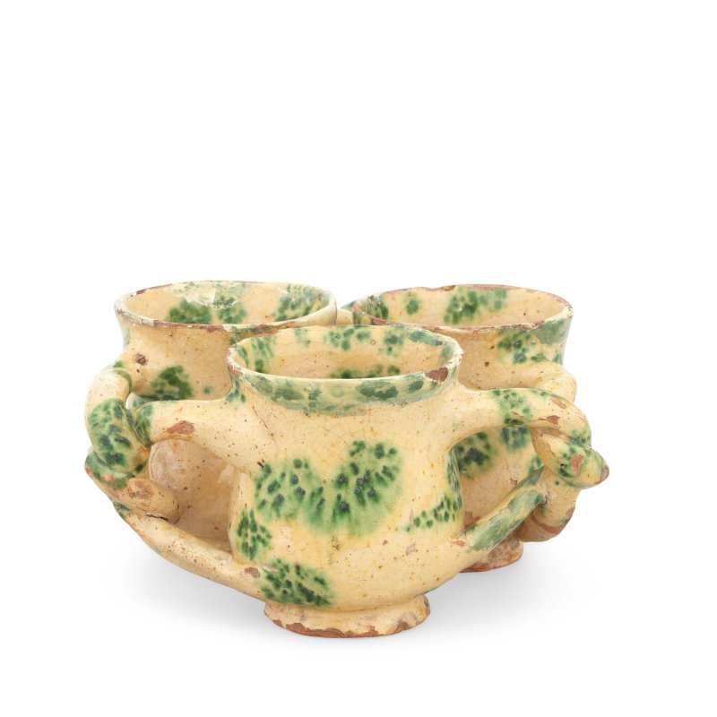 A Donyatt slipware fuddling cup or 'jolly boy', circa 1730-40