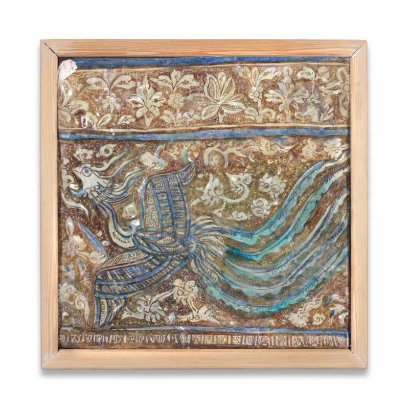 A Kashan lustre moulded pottery tile