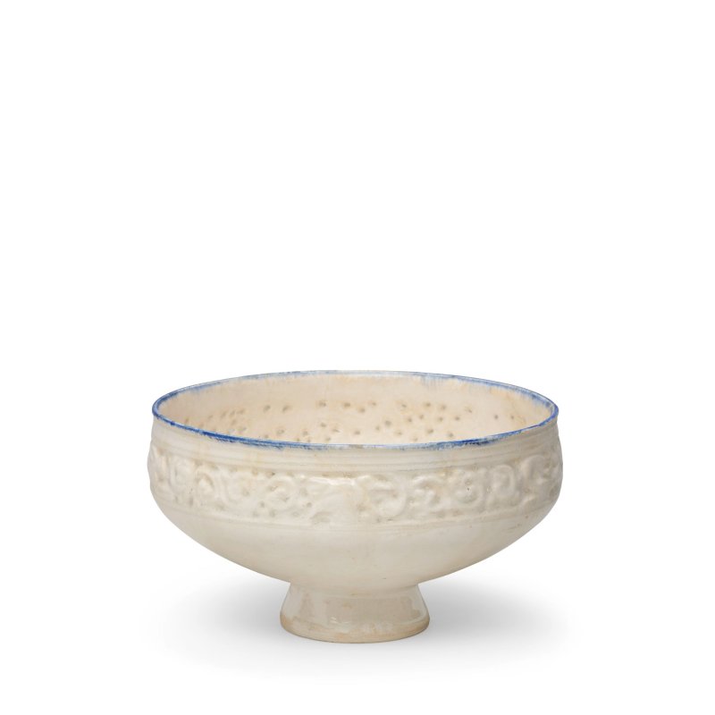 A moulded and pierced pottery bowl