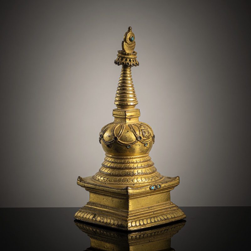 A GILT-BRONZE STUPA