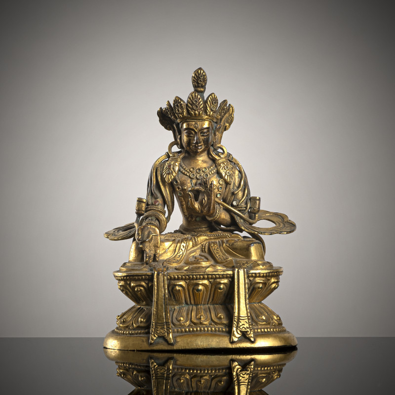 A GILT-COPPER REPOUSSÉ FIGURE OF A BODHISATTVA