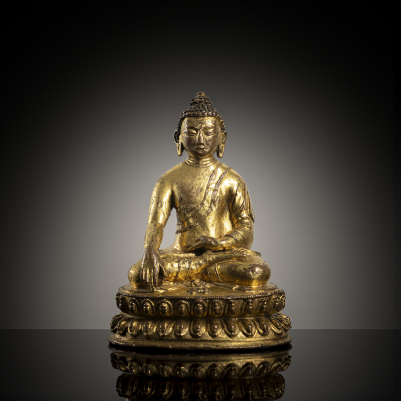 A GILT-COPPER FIGURE OF BUDDHA SHAKYAMUNI