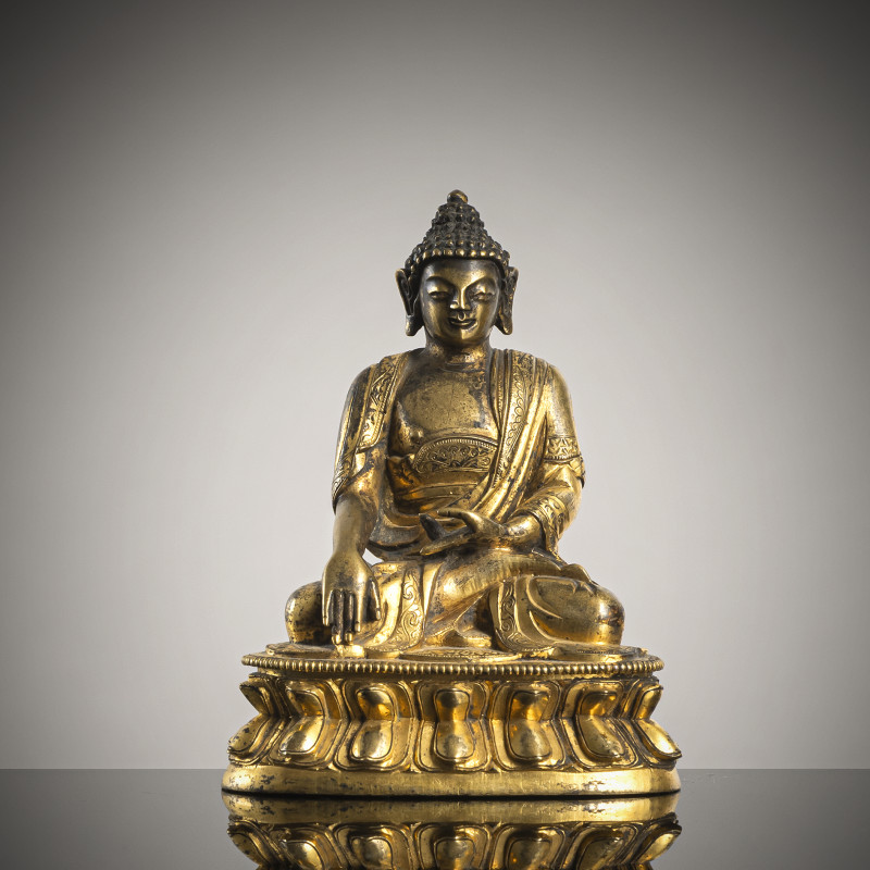 A GILT-BRONZE FIGURE OF BUDDHA SHAKYAMUNI