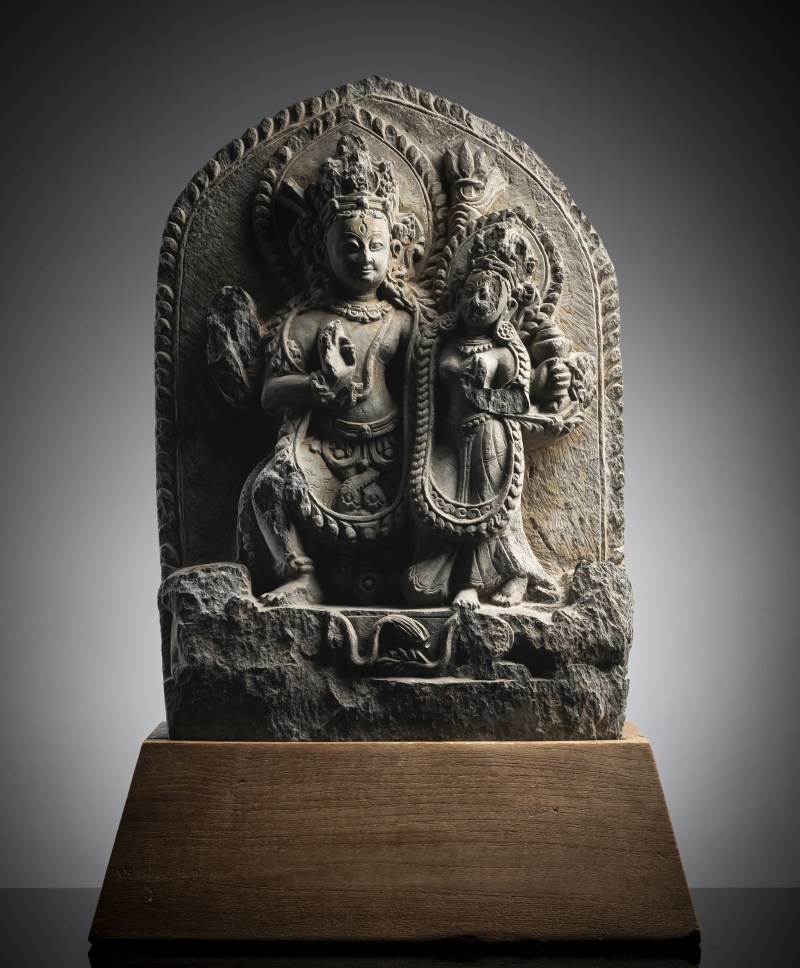 A FINE GREY STONE STELE DEPICTING SHIVA AND PARVATI