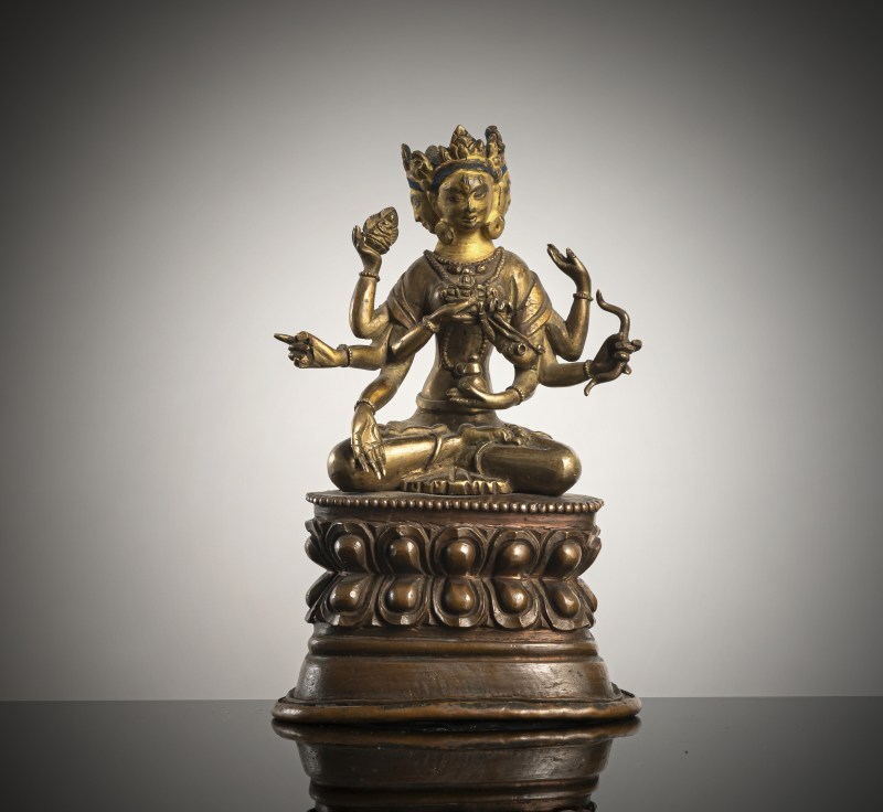 A BRONZE FIGURE OF USHNISHAVIJAYA