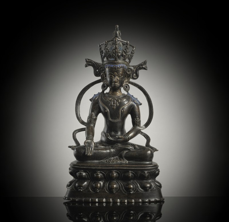 A BRONZE FIGURE OF RATNASAMBHAVA