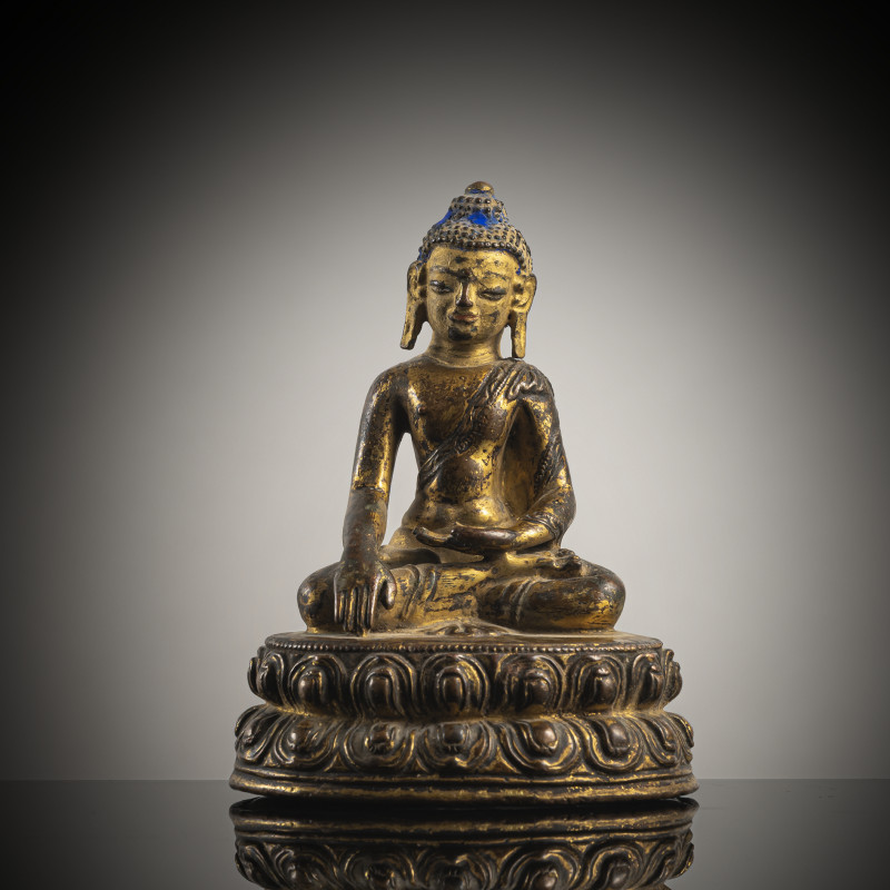 A GILT-COPPER FIGURE OF BUDDHA SHAKYAMUNI