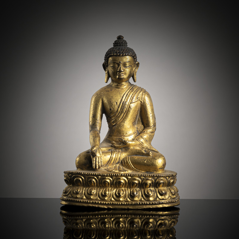 A GILT-BRONZE FIGURE OF BUDDHA SHAKYAMUNI