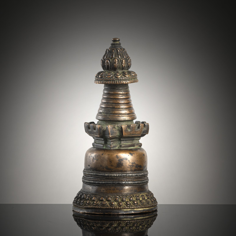 A COPPER STUPA WITH SILVER INLAYS