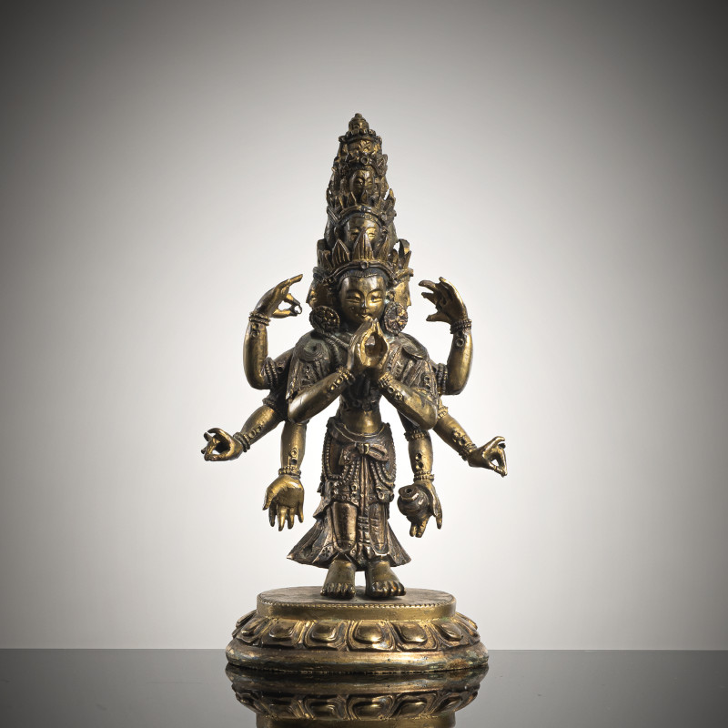 A GILT-BRONZE FIGURE OF EKADASHALOKESHVARA