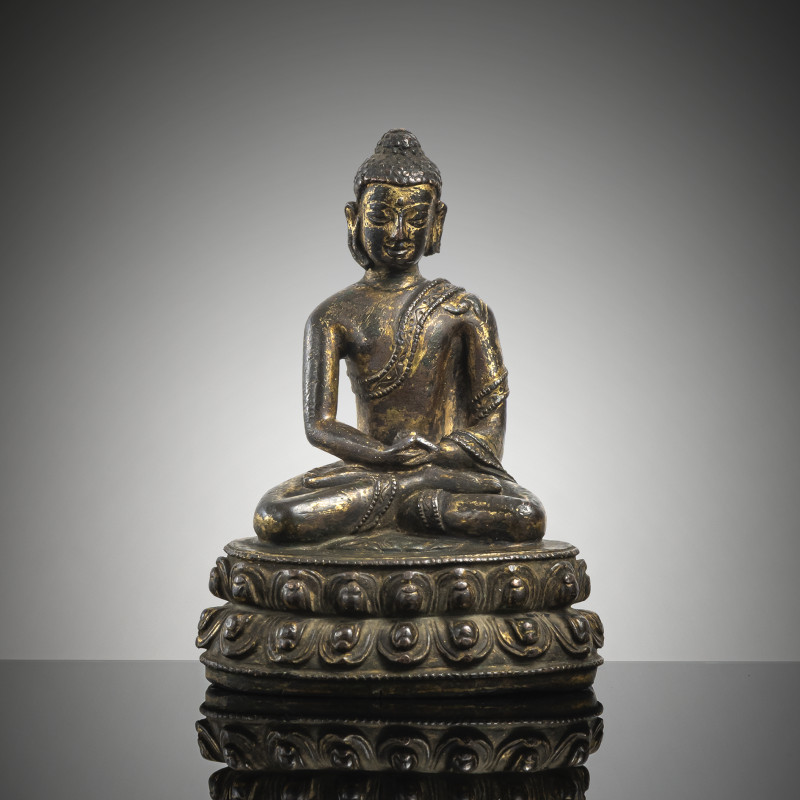 A GILT-COPPER FIGURE OF BUDDHA SHAKYAMUNI