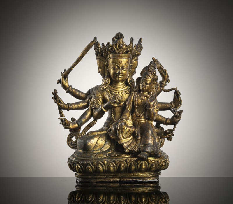 A GILT-BRONZE FIGURE OF MANJUGOSHA AND CONSORT