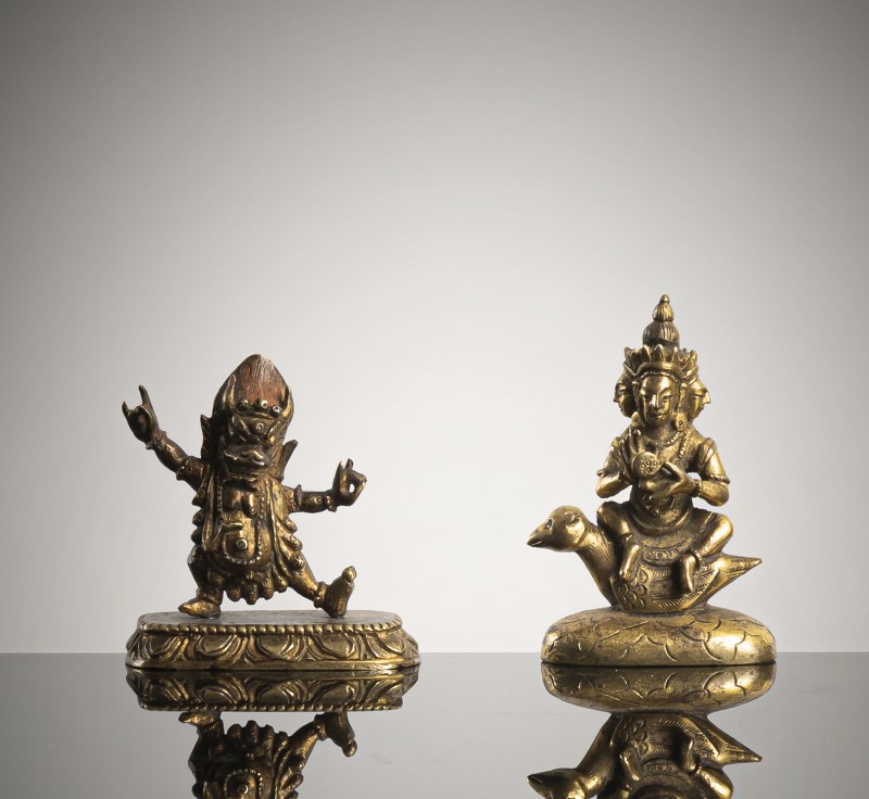 TWO GILT-BRONZE FIGURINES OF A LOCAL DIVINITY AND YAMA