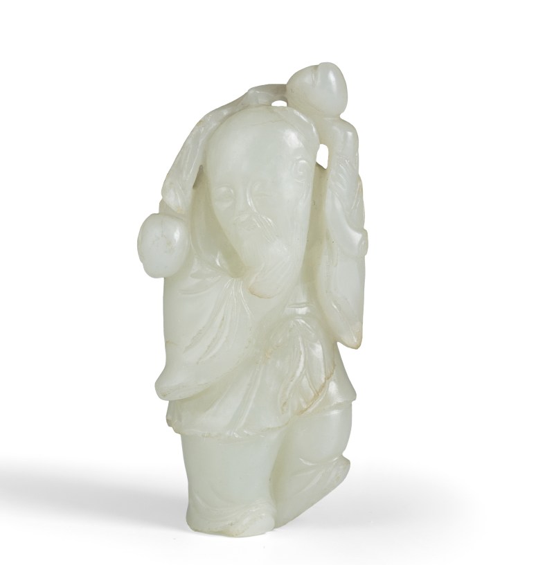 A jade carving of the Shoulao with a peach branch
