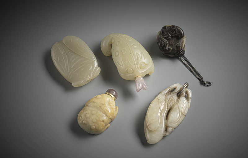 Group of three jade carvings and snuffbottles, some in the shape of toads