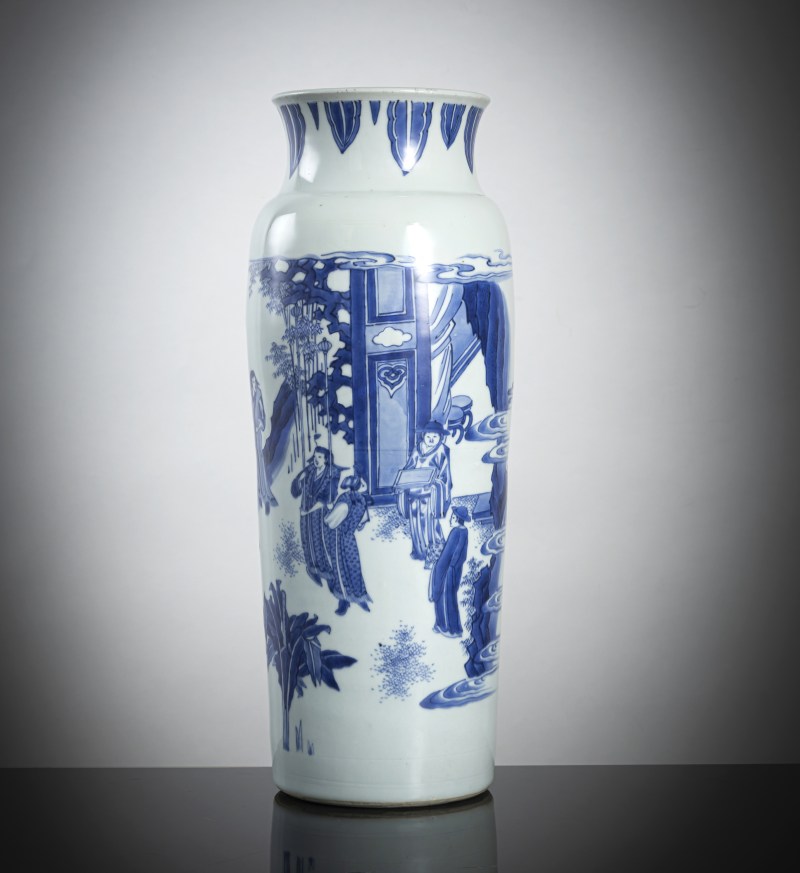 A good Transitional porcelain sleeve vase with underglaze blue decoration of a novel scene