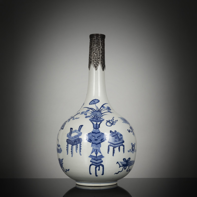 A fine underglaze blue porcelain bottle vase with decoration of antiques and flower vases with silver mounting