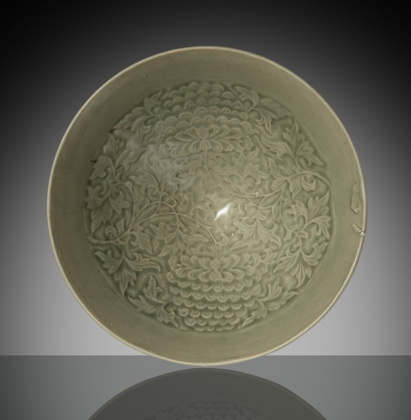 A fine conical 'Yaozhou' ware bowl with carved floral decoration