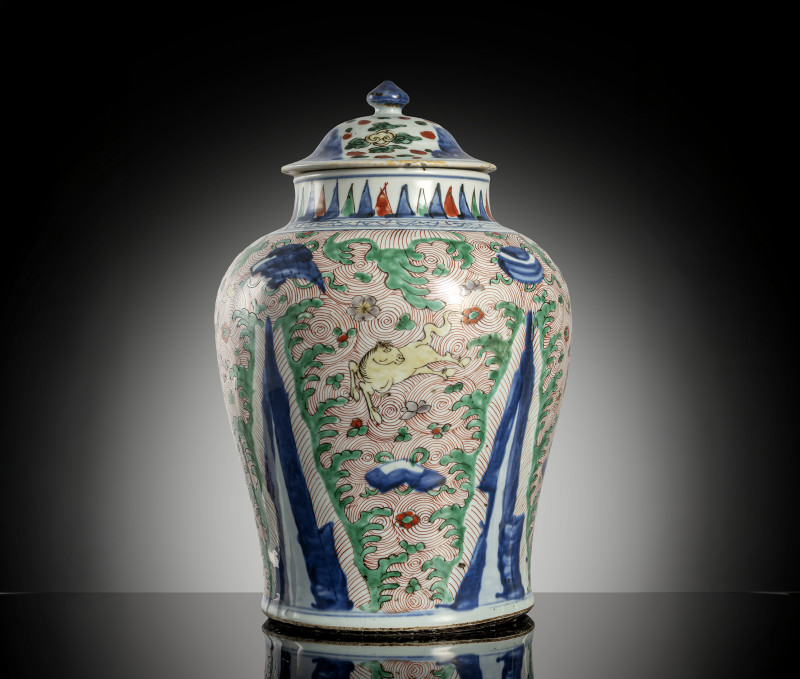 A 'Wucai' porcelain vase and cover with flying horses between waves and emblems