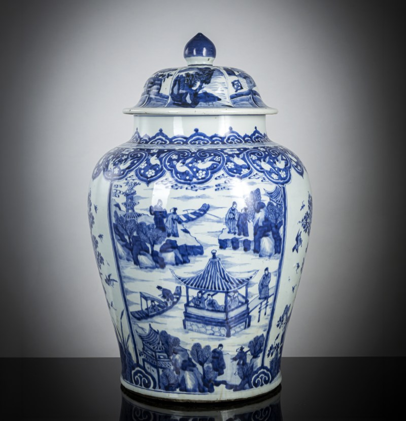 A large porcelain vase and cover with underglaze blue sea landscapes, flowers and birds in reserves around the wall