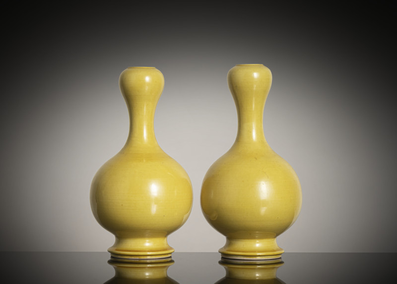 A pair of yellow-glazed "garlic head" porcelain vases