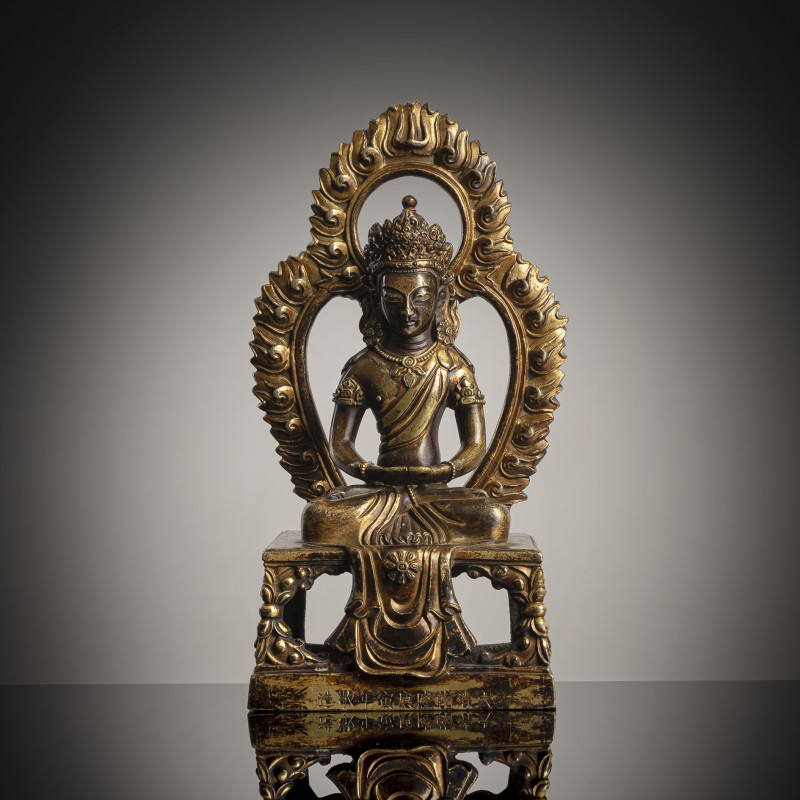 A gilt-bronze figure of Amitayus seated on a throne