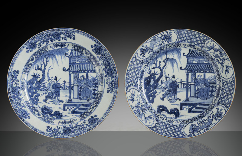 Two round porcelain plates with figural scenes in graduated underglaze blue