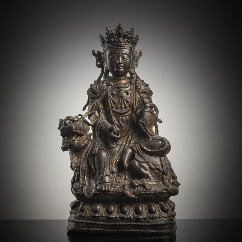 A BRONZE FIGURE OF GUANYIN