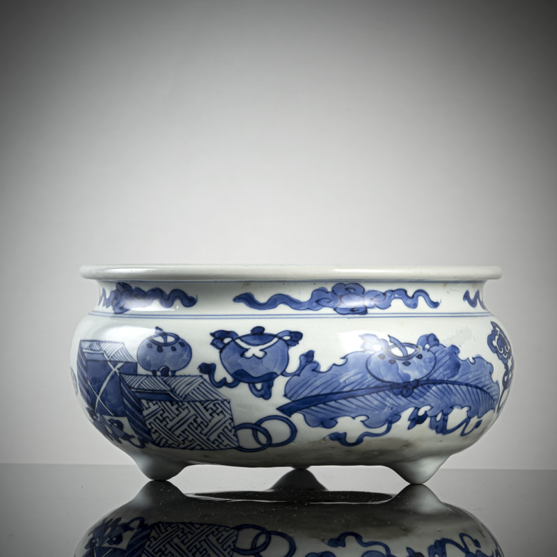 A BLUE AND WHITE BOMBÉ TRIPOD CENSER