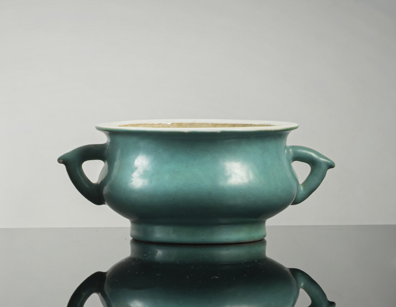 A blue-green glazed twin-handled porcelain censer
