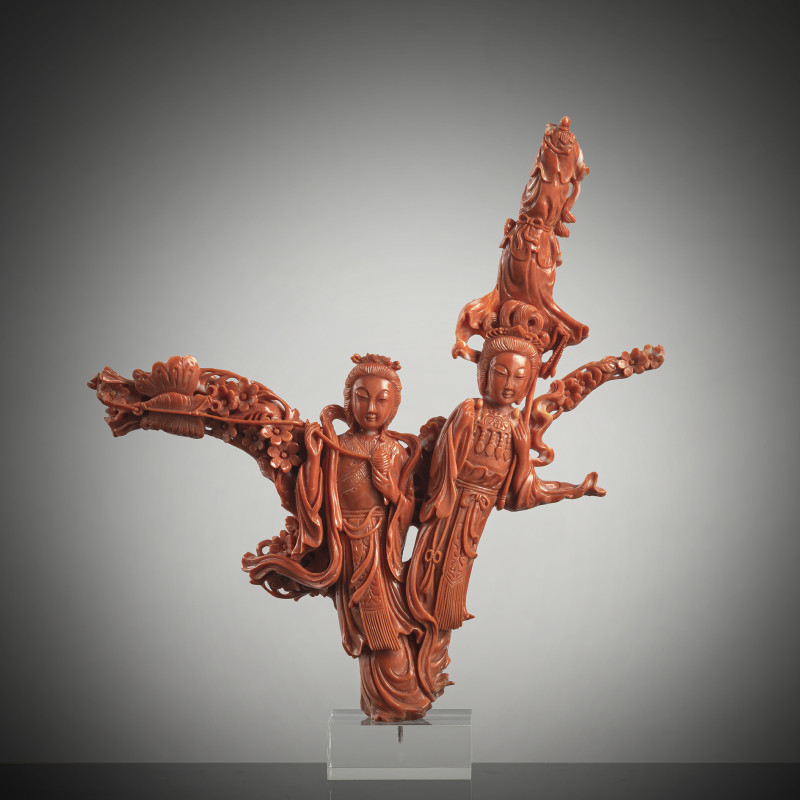 A coral carving of two figures