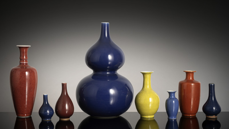 A group of nine monochrome glazed porcelain vases, partly marked