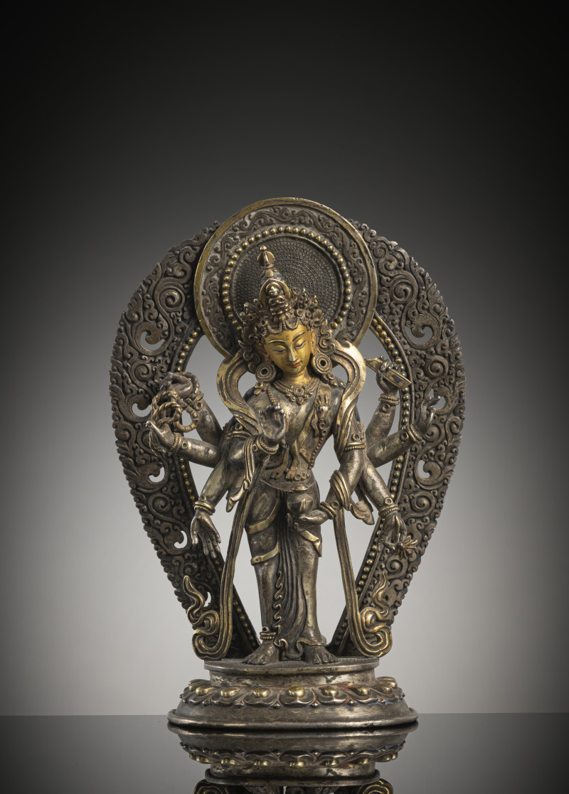 Partially fire-gilded silver figure of Amoghapasha
