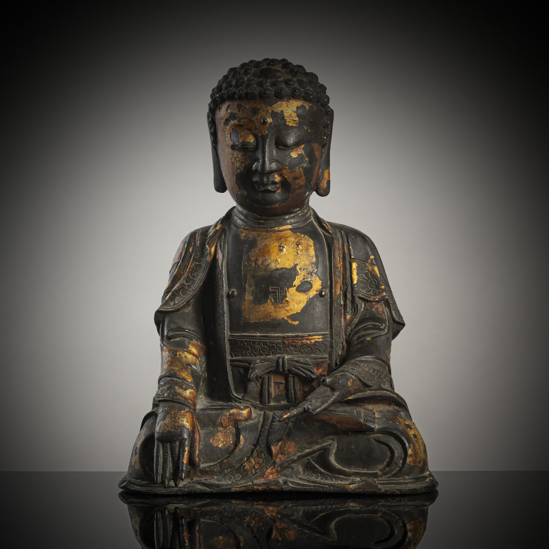 A bronze figure of seated Buddha Shakyamuni
