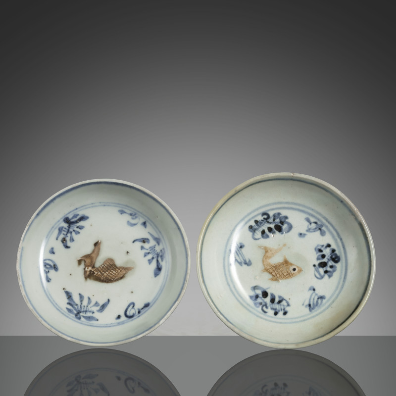 A pair of small moulded fish bowls and underglaze blue decoration