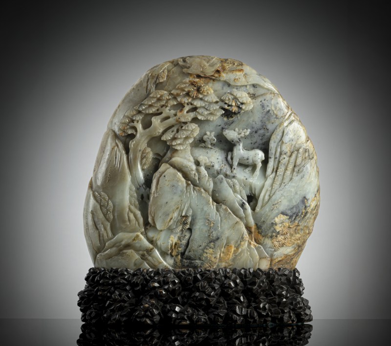 A large carved green jade boulder depicting scholars in a mountain landscape, mounted on a wooden stand - 图2