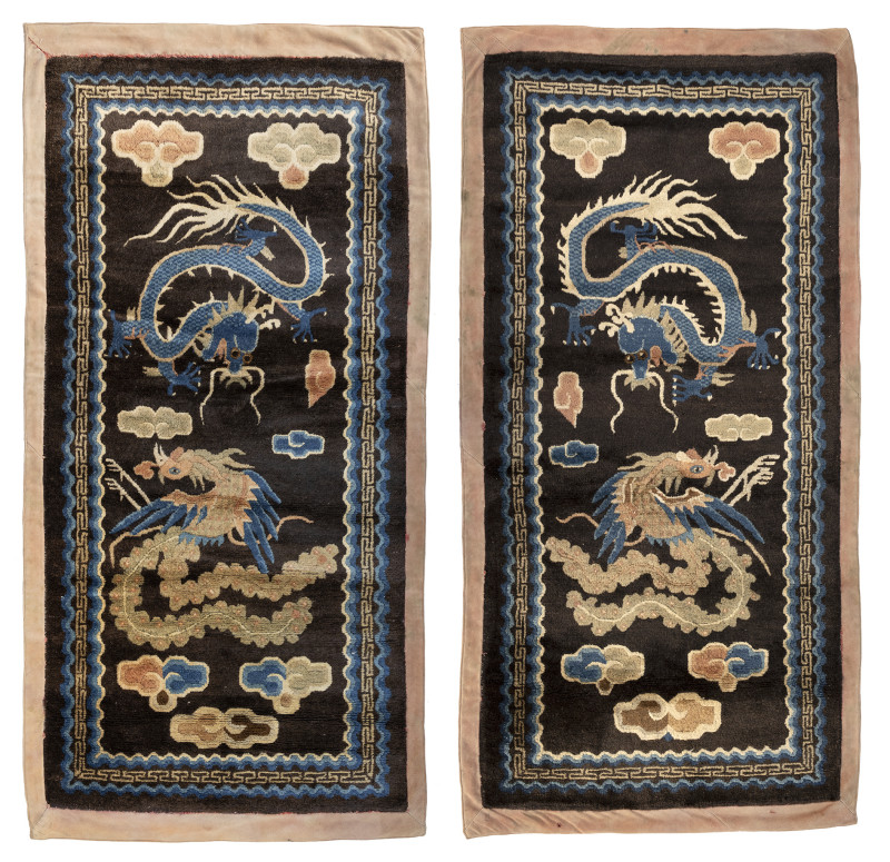 A pair of dragon rugs