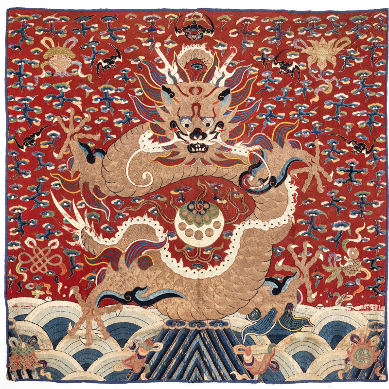 A hanging with a large frontal dragon and the Ashtamangala
