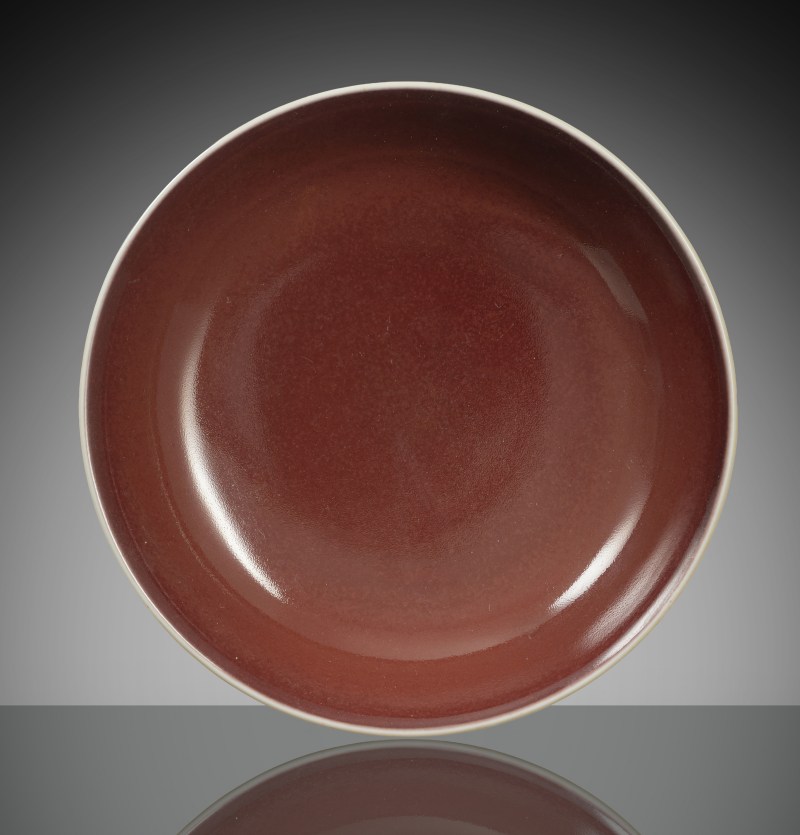 An Imperial porcelain 'saucer' with copper-red glaze
