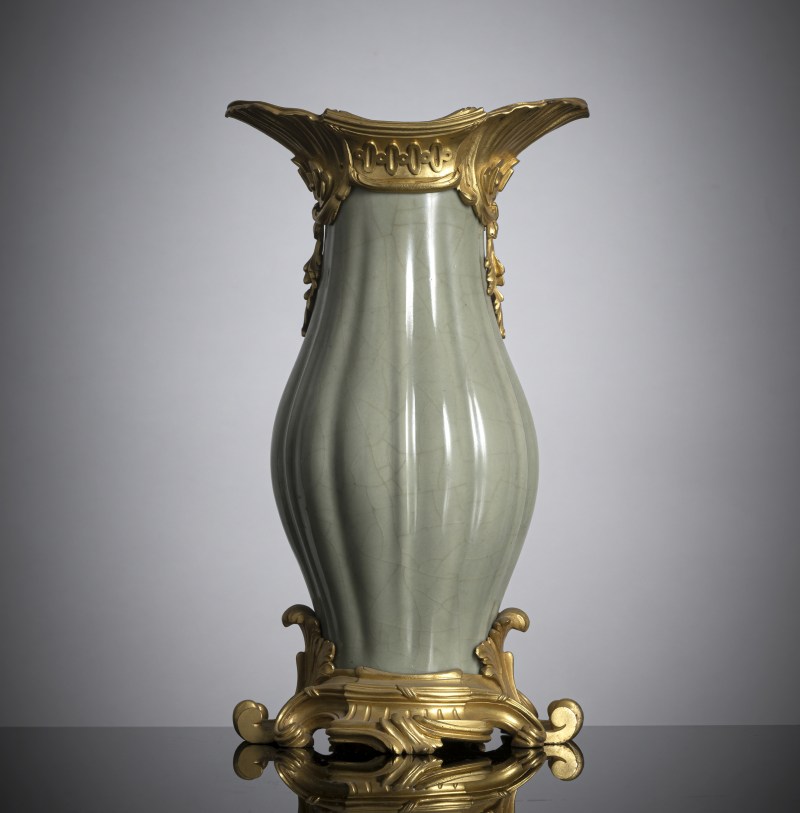 A ribbed porcelain celadon vase in a fine ormolu mount