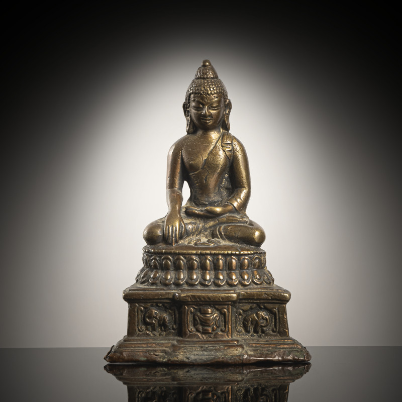 A BRONZE FIGURE OF AKSHOBHYA