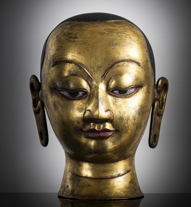 A RARE EMBOSSED COPPER RITUAL HEAD