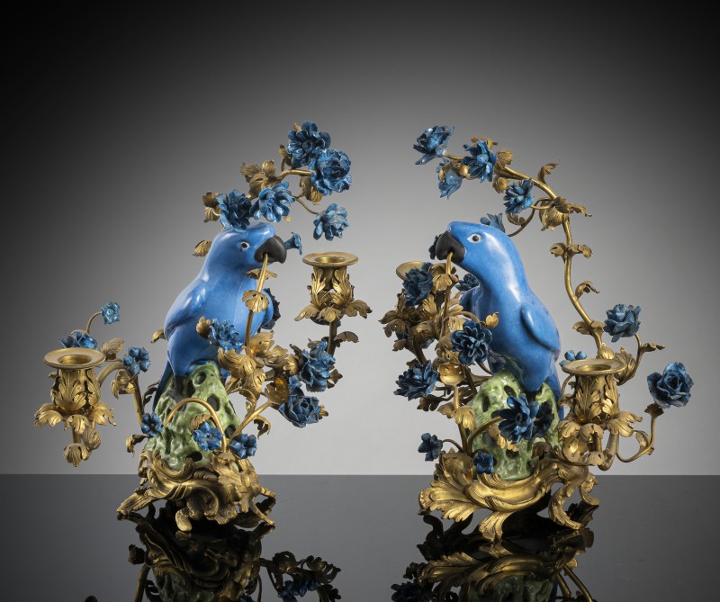 A pair of parrots as candle holders with magnificent mounting