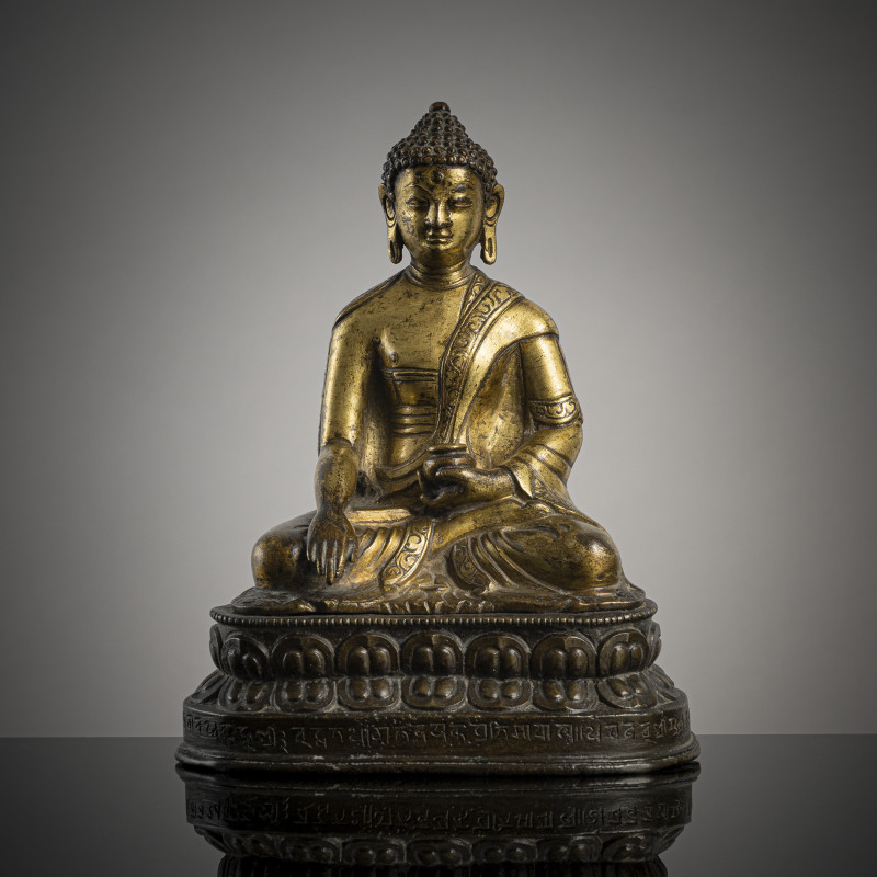 A GILT-COPPER FIGURE OF BUDDHA SHAKYAMUNI