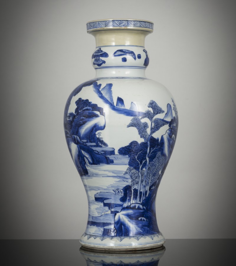 A fine porcelain baluster vase with underglaze blue seascape and floral decoration with pheasant on the reverse
