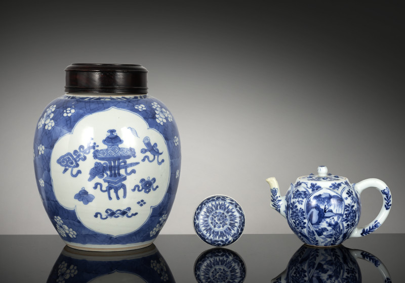 A Ginger jar with wooden cover, a teapot and cover and a box and cover, all with underglaze blue decoration